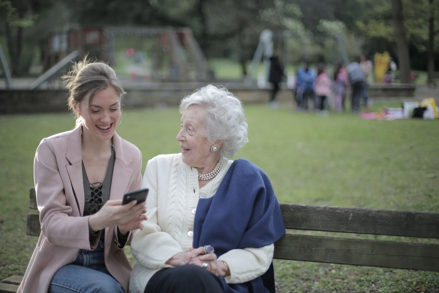 An older person enjoying time outdoors with a companion
